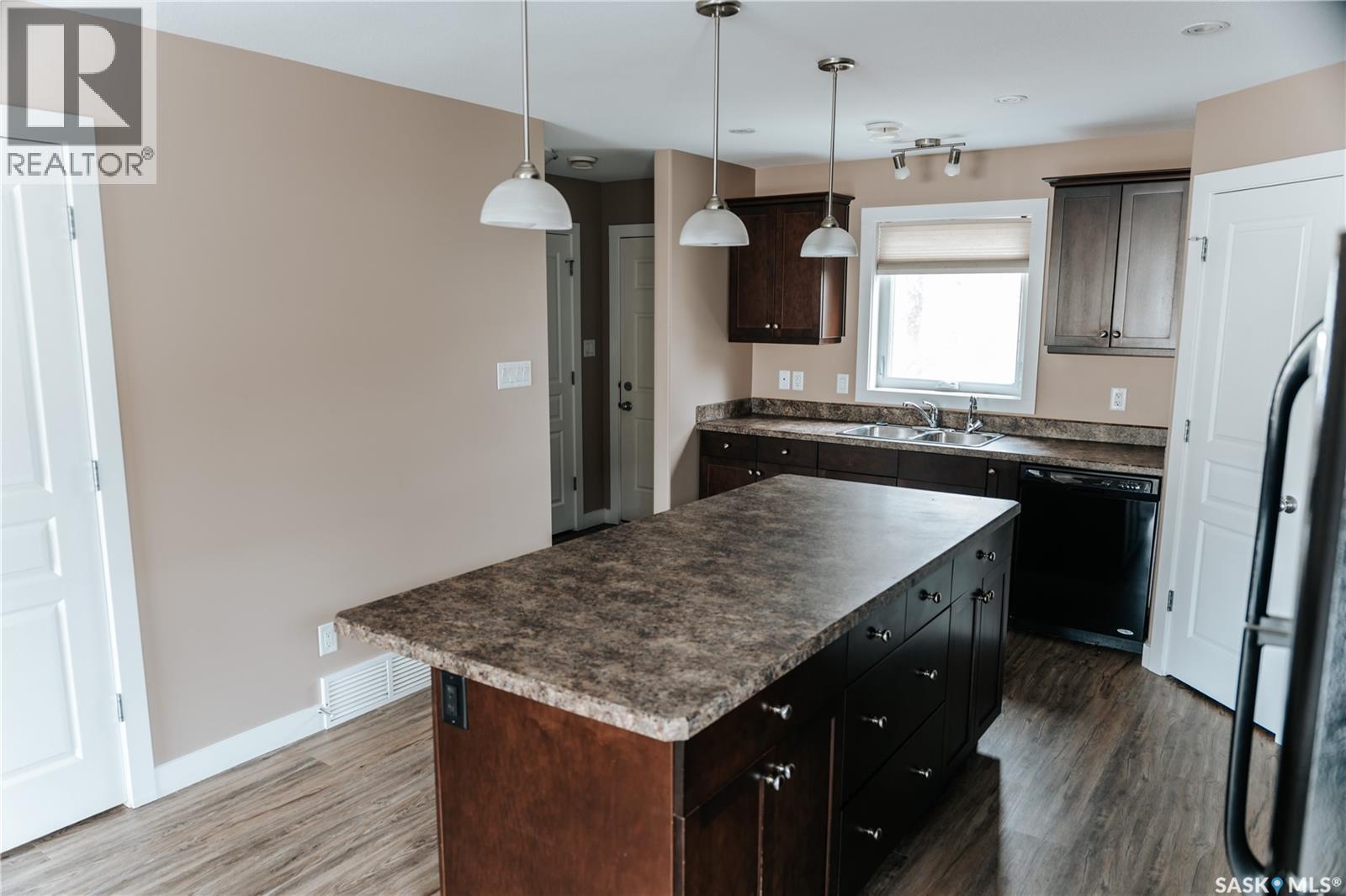 145 Mcintyre Street N, Regina, SK - Indoor Photo Showing Kitchen With Double Sink