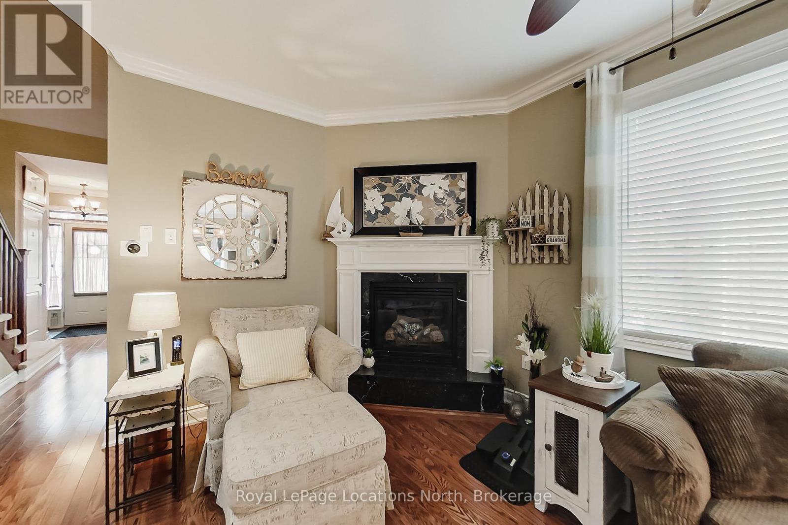 23 Covington Blue Crescent, Wasaga Beach, ON - Indoor Photo Showing Living Room With Fireplace