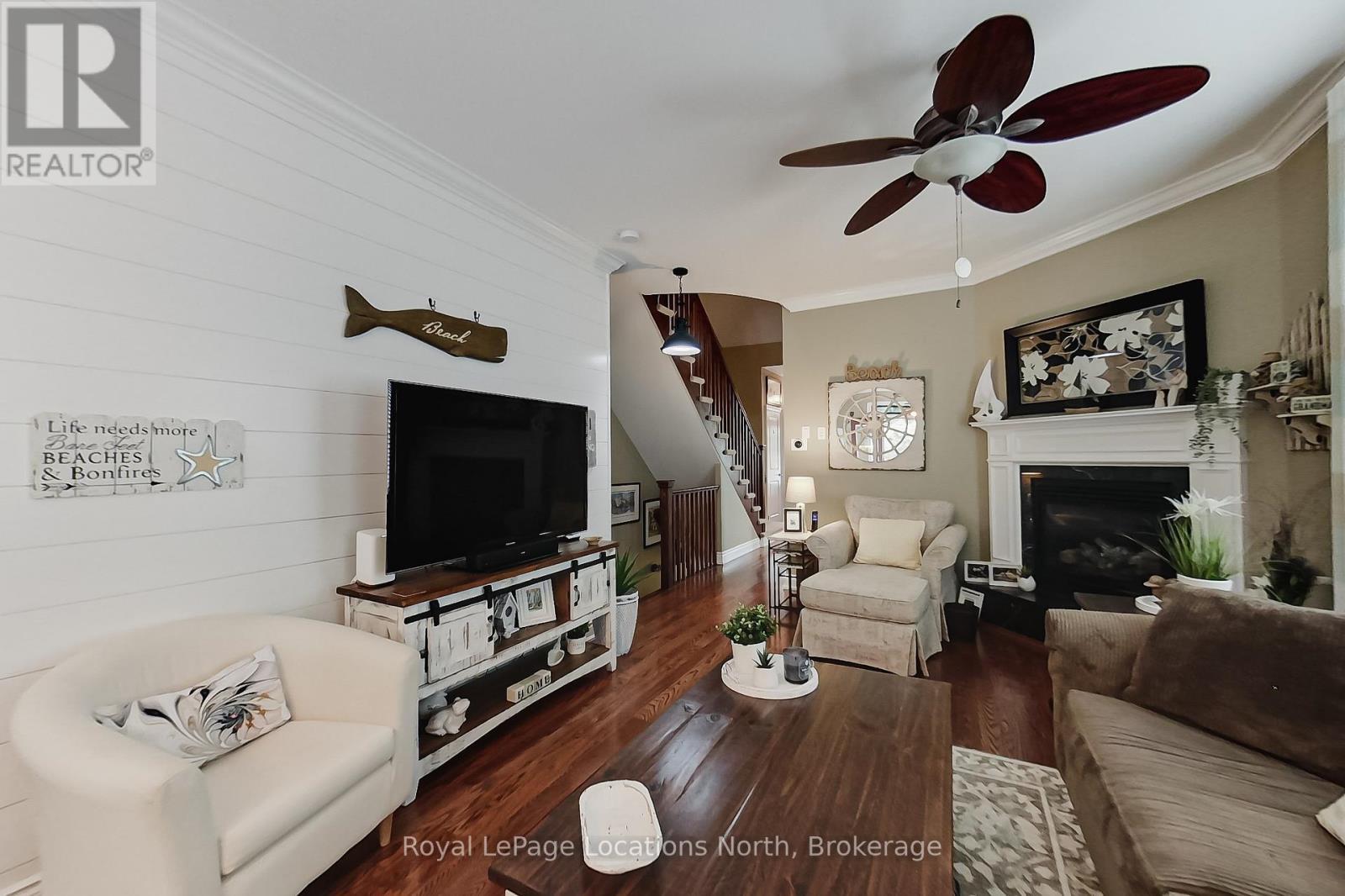 23 Covington Blue Crescent, Wasaga Beach, ON - Indoor Photo Showing Living Room With Fireplace
