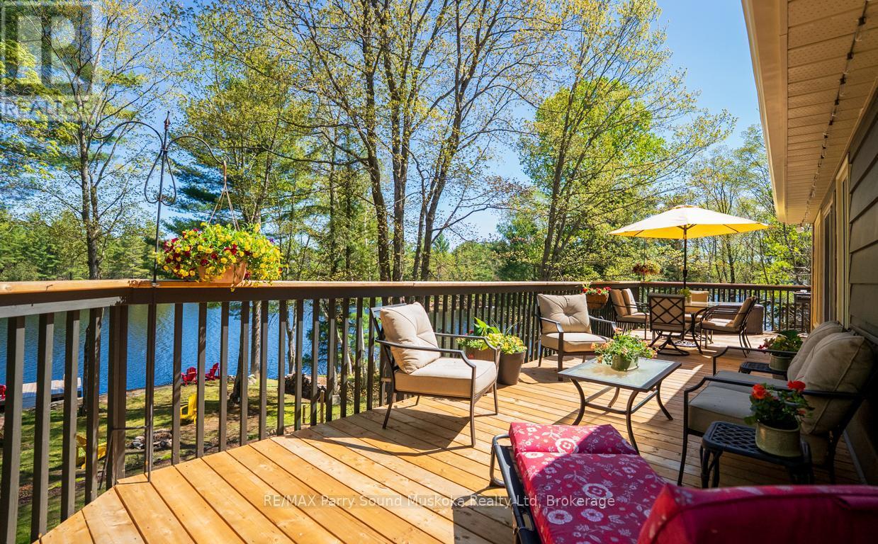 Fabulous decking to relax - 13 Peninsula Shores Road E, Mcdougall, ON - Outdoor With Deck Patio Veranda
