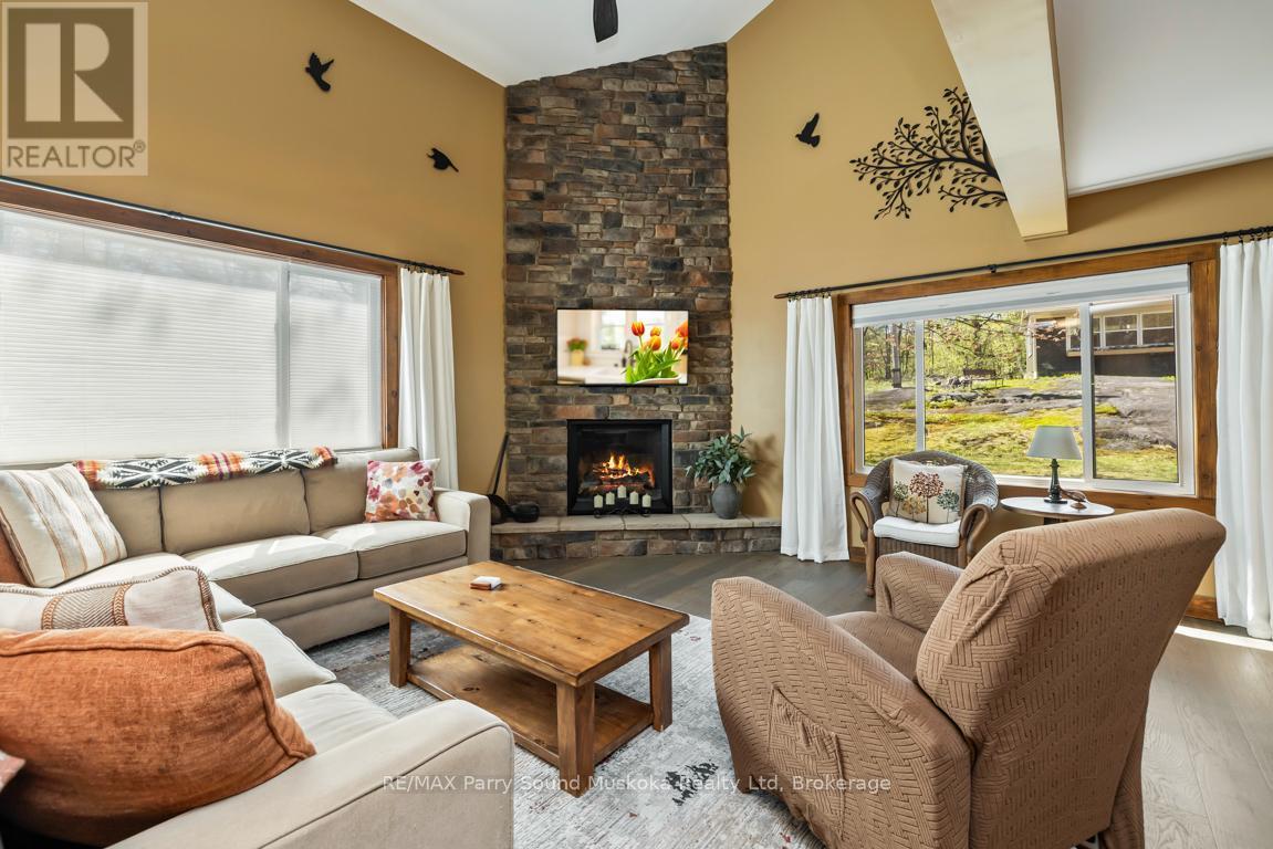 Captivating Great Room - 13 Peninsula Shores Road E, Mcdougall, ON - Indoor Photo Showing Living Room With Fireplace