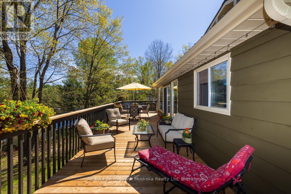Fabulous lakeside decking - 13 Peninsula Shores Road E, Mcdougall, ON - Outdoor With Deck Patio Veranda With Exterior
