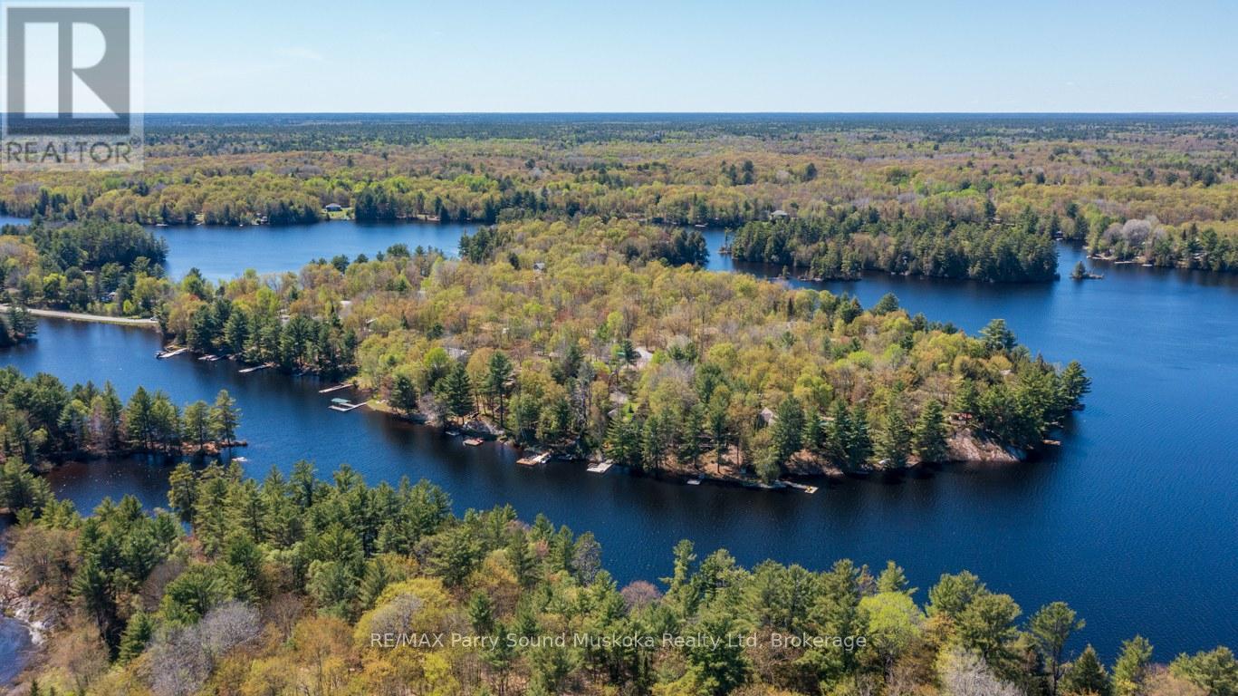 Great boating, exploring on Harris Lake! - 13 Peninsula Shores Road E, Mcdougall, ON - Outdoor With Body Of Water With View