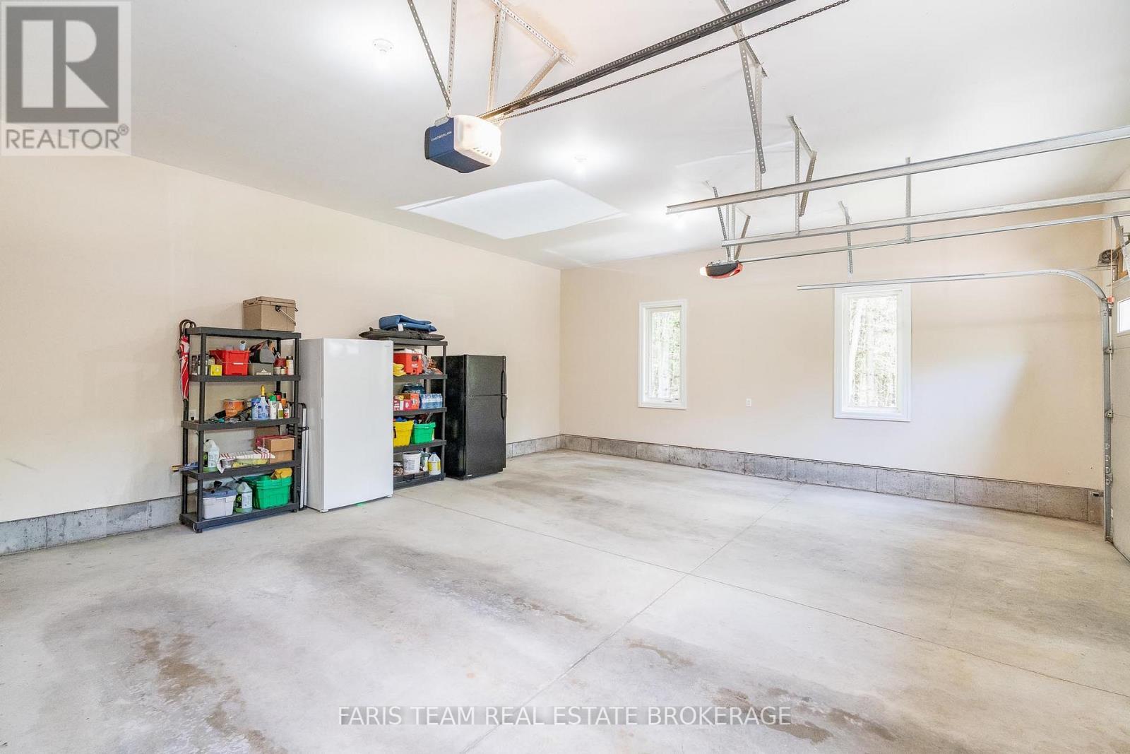 470 Baseline Road S, Tiny, ON - Indoor Photo Showing Garage