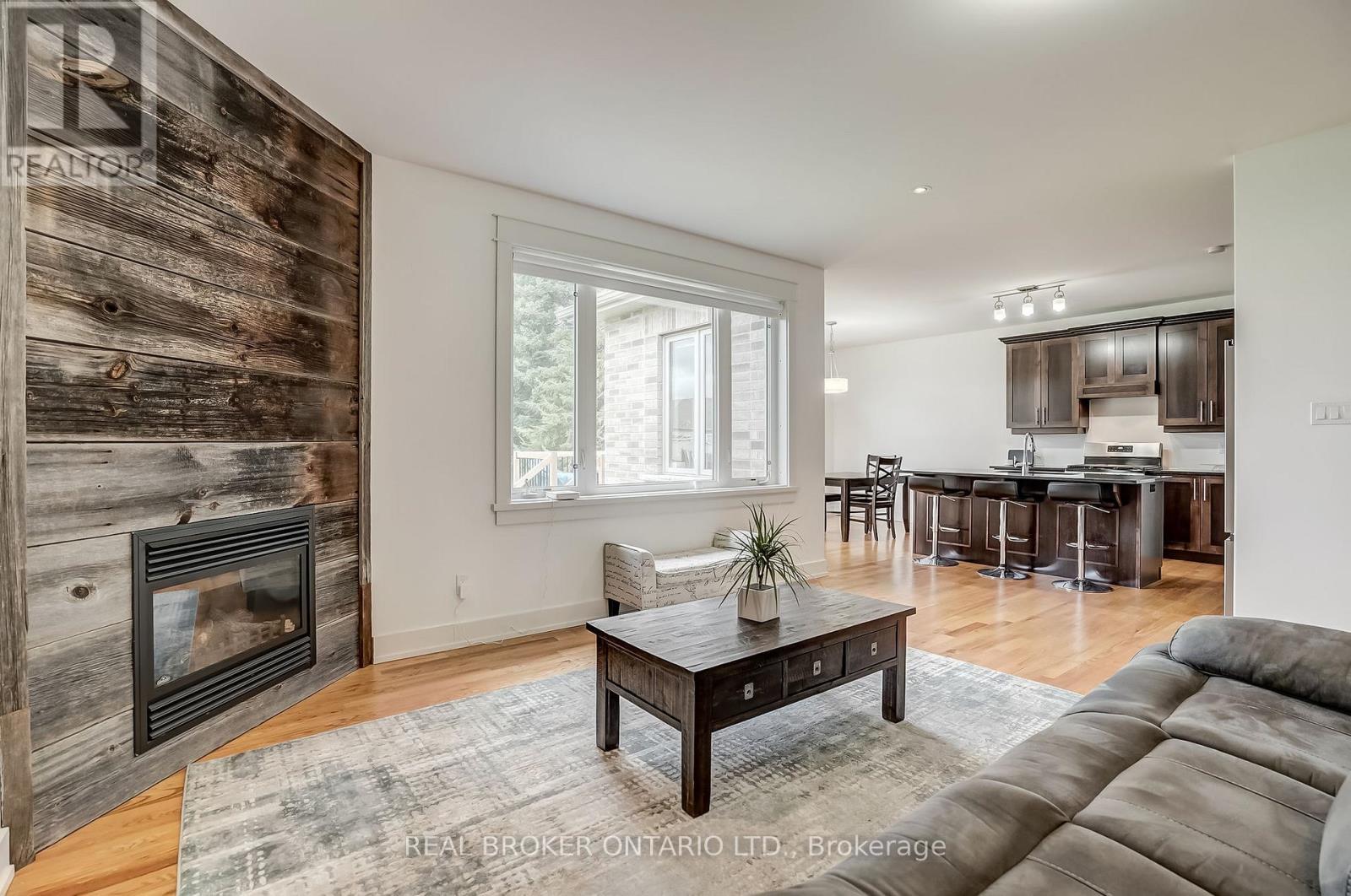 6237 Perth Street, Ottawa, ON - Indoor Photo Showing Living Room With Fireplace
