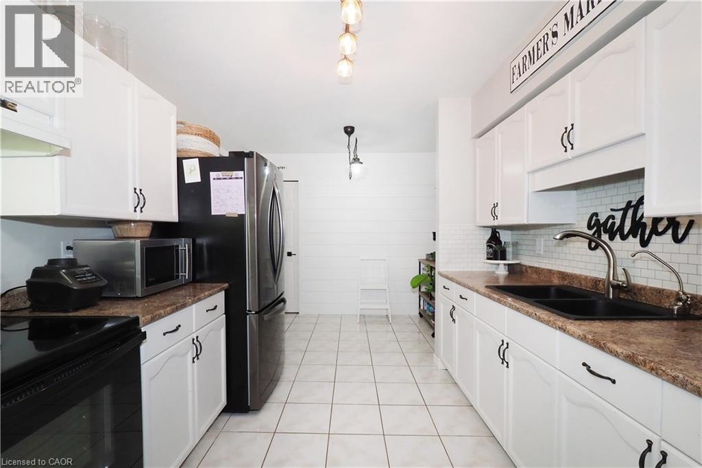 Kitchen - 15 Dales Drive, Drayton, ON - Indoor Photo Showing Kitchen With Double Sink