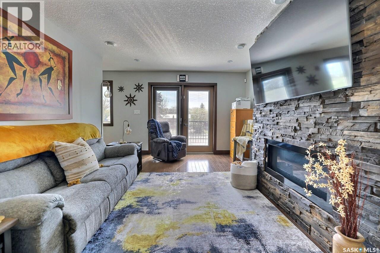 1456 Mccarthy Boulevard, Regina, SK - Indoor Photo Showing Living Room With Fireplace