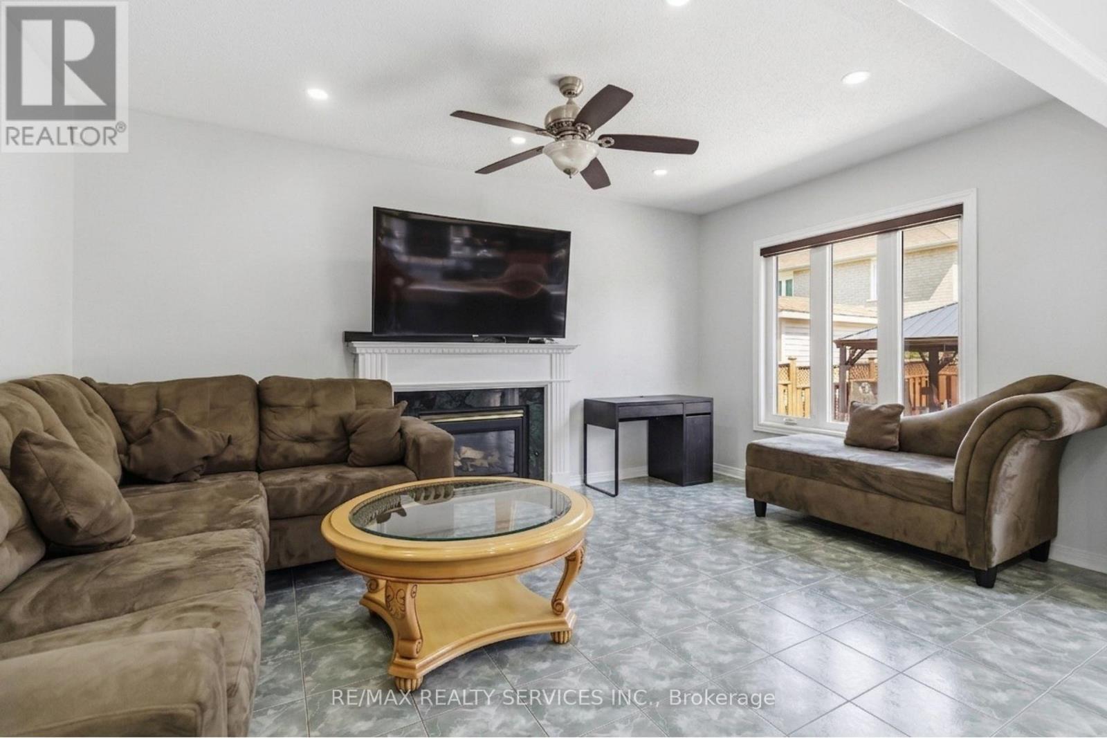 8 Pacific Wind Crescent, Brampton, ON - Indoor Photo Showing Living Room With Fireplace