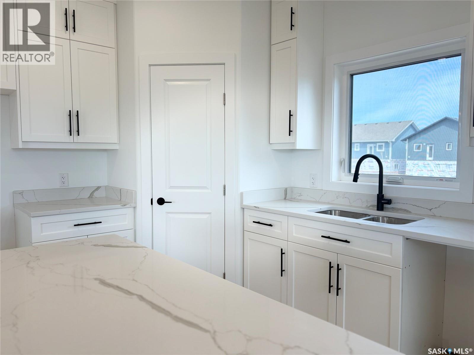 106 Lakewood Drive, Humboldt, SK - Indoor Photo Showing Kitchen With Double Sink