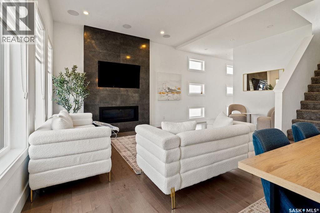 4238 Green Olive Way E, Regina, SK - Indoor Photo Showing Living Room With Fireplace