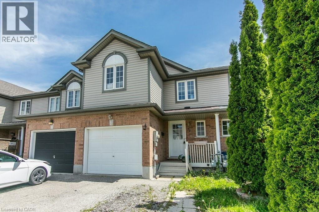 Two-story townhome featuring a brick and siding exterior with a pitched roof - 71 Foxglove Crescent, Kitchener, ON - Outdoor