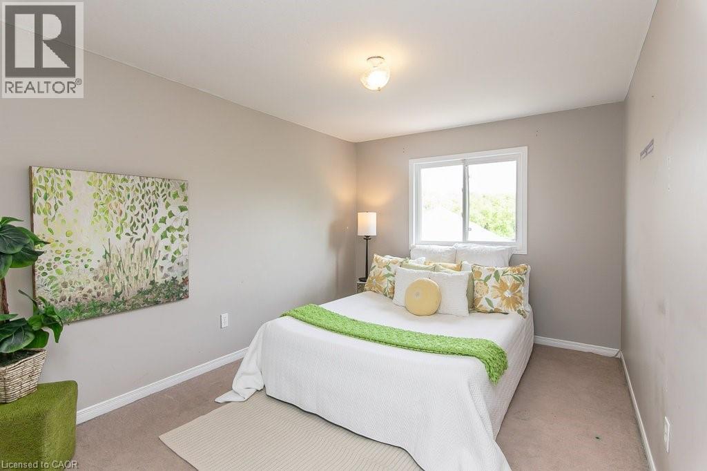 Neutral-toned walls complement the light-colored carpet flooring - 71 Foxglove Crescent, Kitchener, ON - Indoor Photo Showing Bedroom