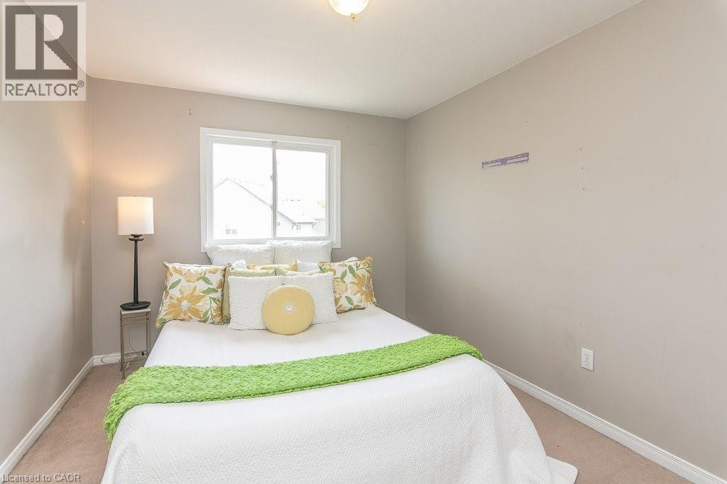 Neutral-toned walls complement the light brown carpeting - 71 Foxglove Crescent, Kitchener, ON - Indoor Photo Showing Bedroom