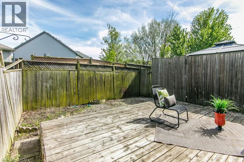 Wood-plank outdoor deck with partial privacy fencing and a gazebo structure - 71 Foxglove Crescent, Kitchener, ON - Outdoor With Deck Patio Veranda