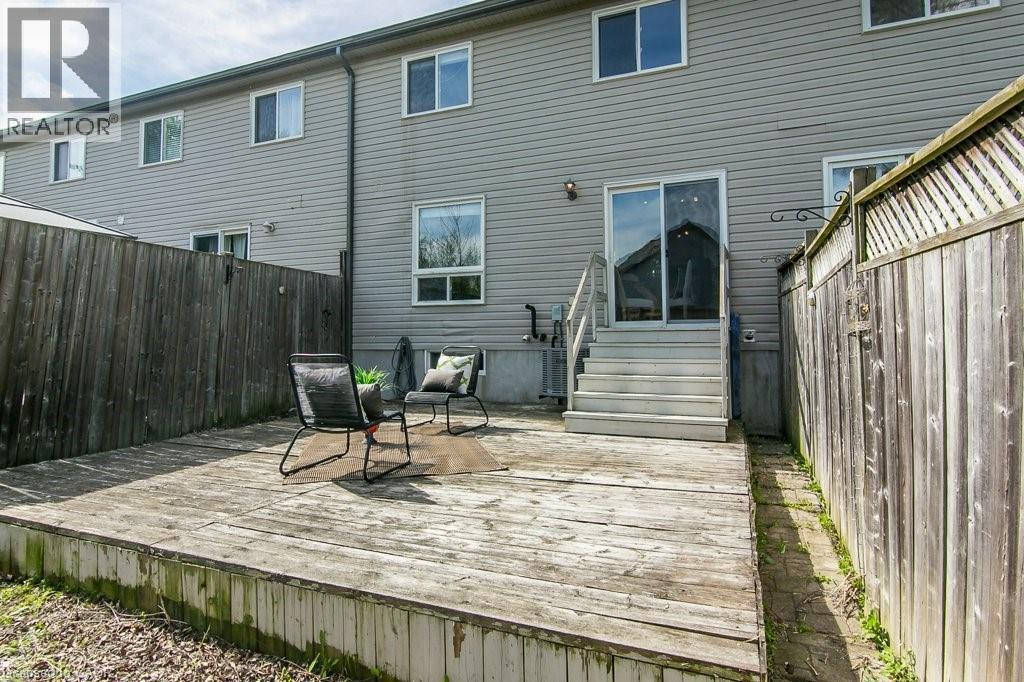 Expansive wood deck with stairs providing access to the property's sliding glass patio door - 71 Foxglove Crescent, Kitchener, ON - Outdoor With Deck Patio Veranda With Exterior