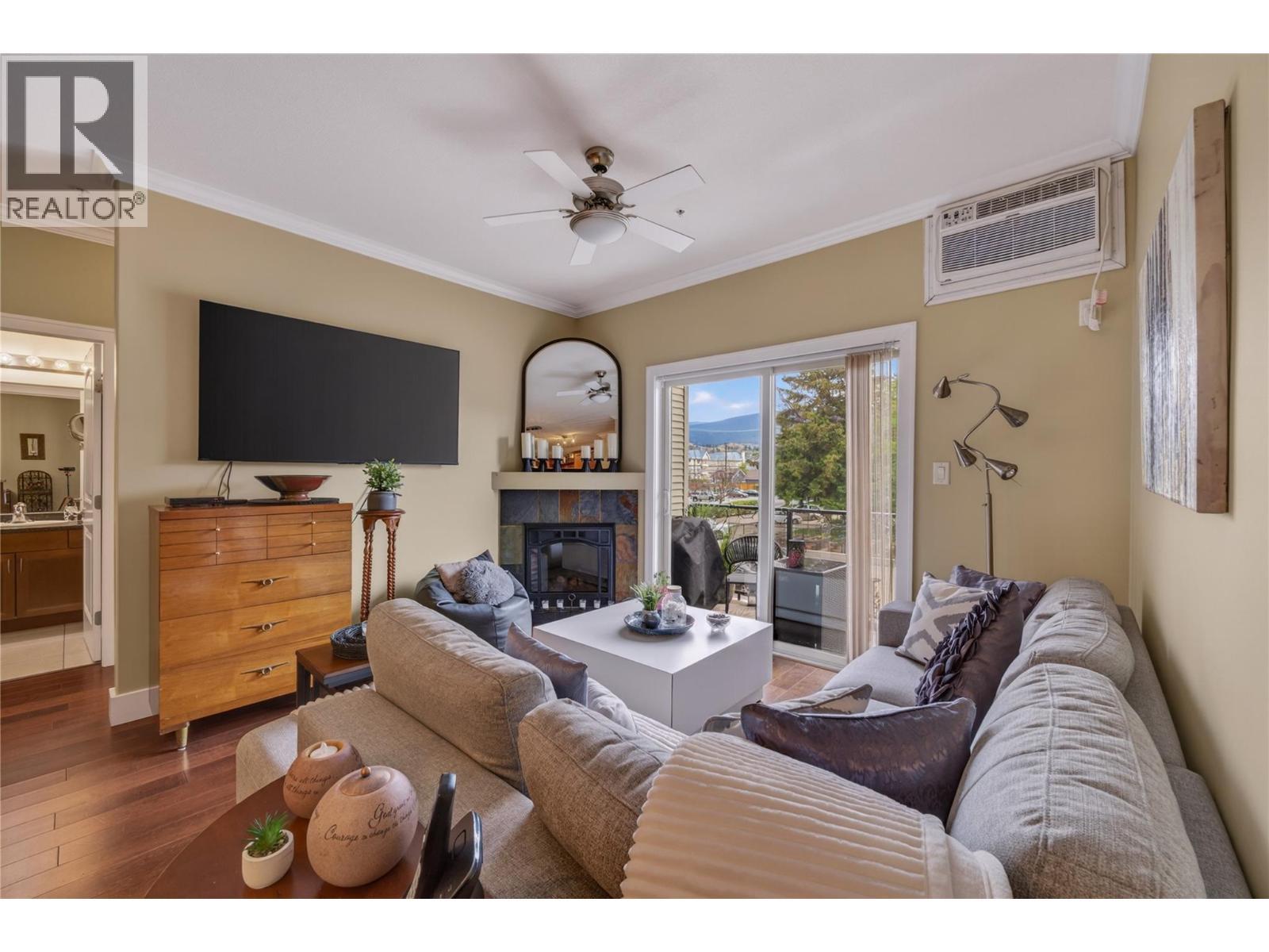 240 Wade Avenue W Avenue Unit# 305, Penticton, BC - Indoor Photo Showing Living Room With Fireplace