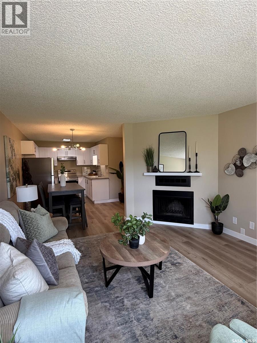 358 Cedar Meadow Drive, Regina, SK - Indoor Photo Showing Living Room With Fireplace