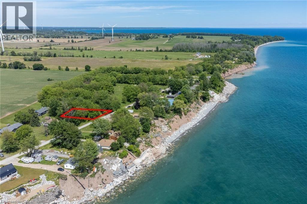 Expansive wooded parcel with clear boundaries, situated directly on a waterfront bluff - 28 Derner Line, Lowbanks, ON - Outdoor With Body Of Water With View