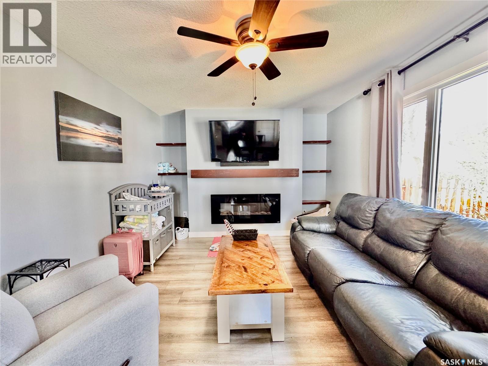 719 4Th Street E, Prince Albert, SK - Indoor Photo Showing Living Room With Fireplace