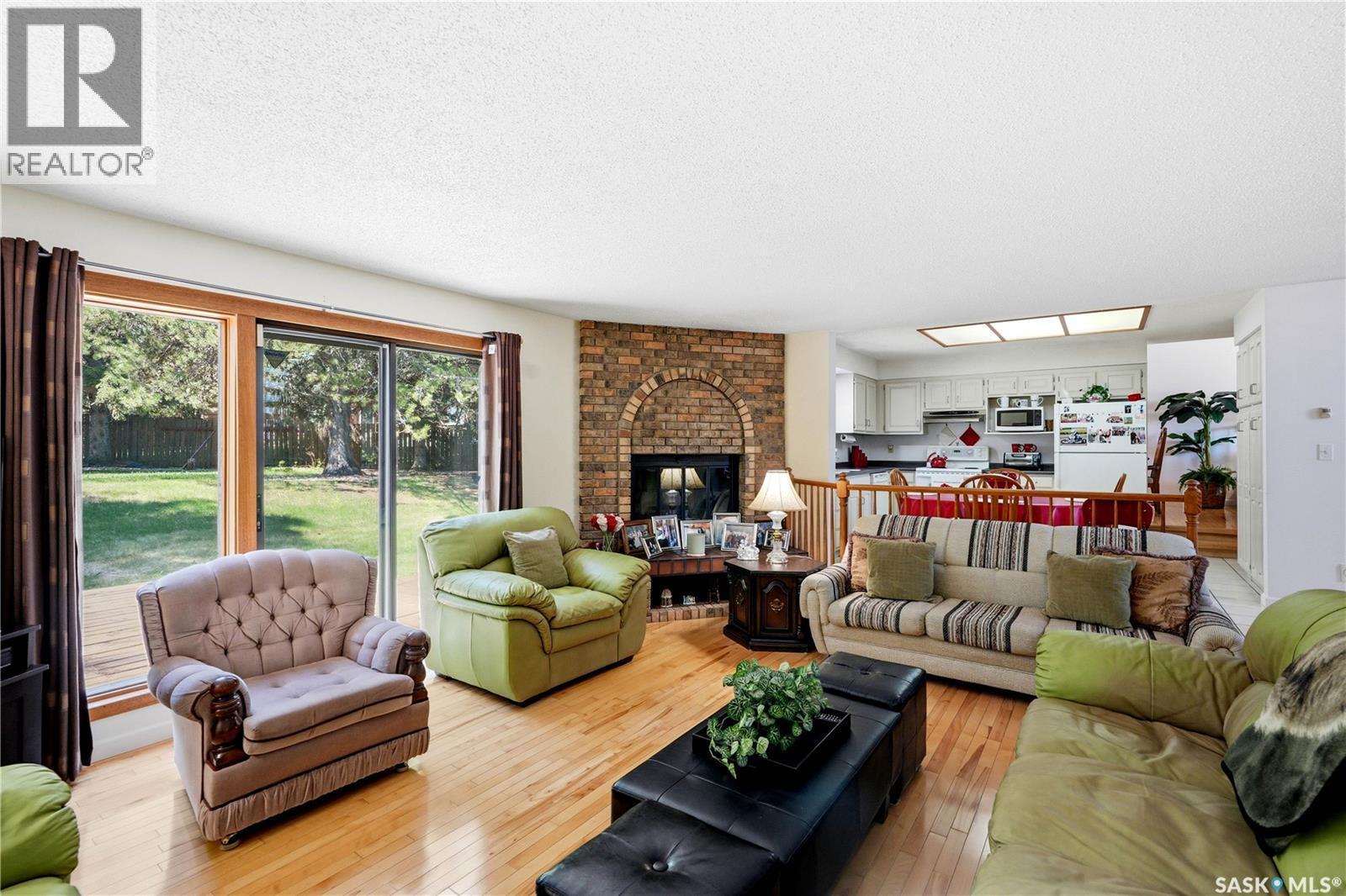 719 Wakaw Terrace, Saskatoon, SK - Indoor Photo Showing Living Room With Fireplace