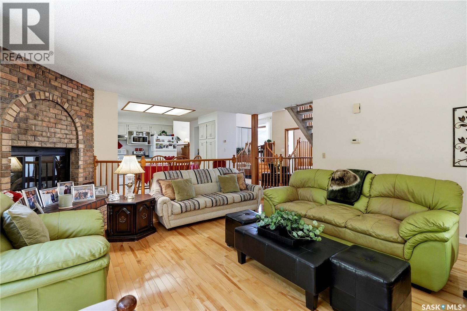 719 Wakaw Terrace, Saskatoon, SK - Indoor Photo Showing Living Room With Fireplace
