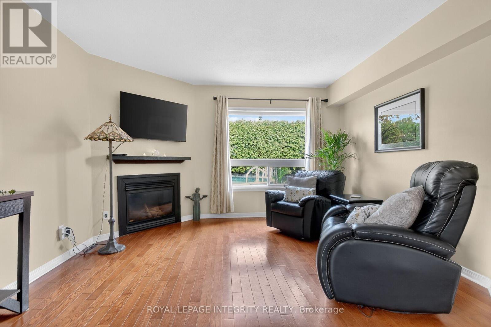 1 Chantilly Gate, Ottawa, ON - Indoor Photo Showing Living Room With Fireplace