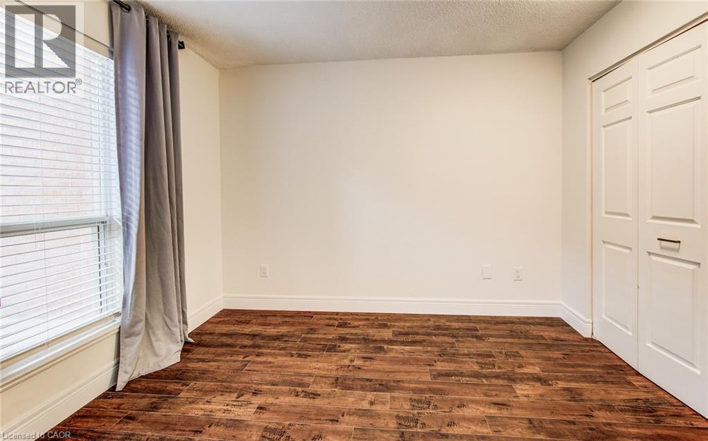 Spacious double closet in the bedroom - 1414 King Street E Unit# 101, Kitchener, ON - Indoor Photo Showing Other Room