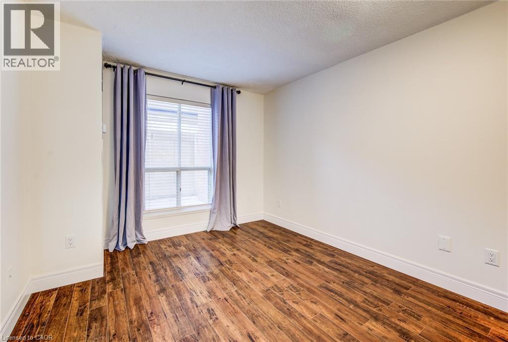 Large window in the bedroom - 1414 King Street E Unit# 101, Kitchener, ON - Indoor Photo Showing Other Room