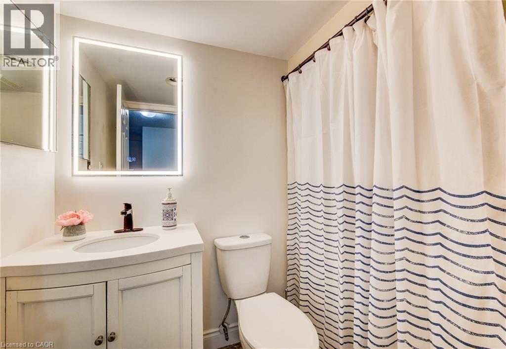 Updated bath has new counter, vanity, tap and mirror - 1414 King Street E Unit# 101, Kitchener, ON - Indoor Photo Showing Bathroom