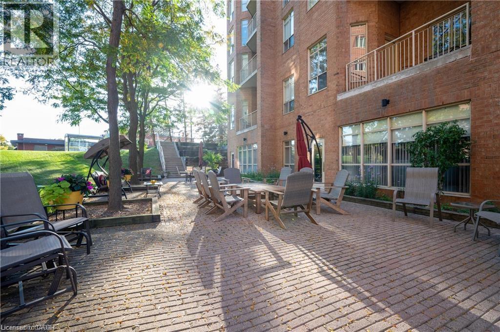 Community use patio - 1414 King Street E Unit# 101, Kitchener, ON - Outdoor