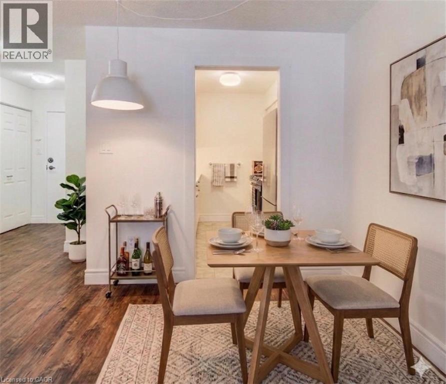 Virtually staged dining space - 1414 King Street E Unit# 101, Kitchener, ON - Indoor Photo Showing Dining Room