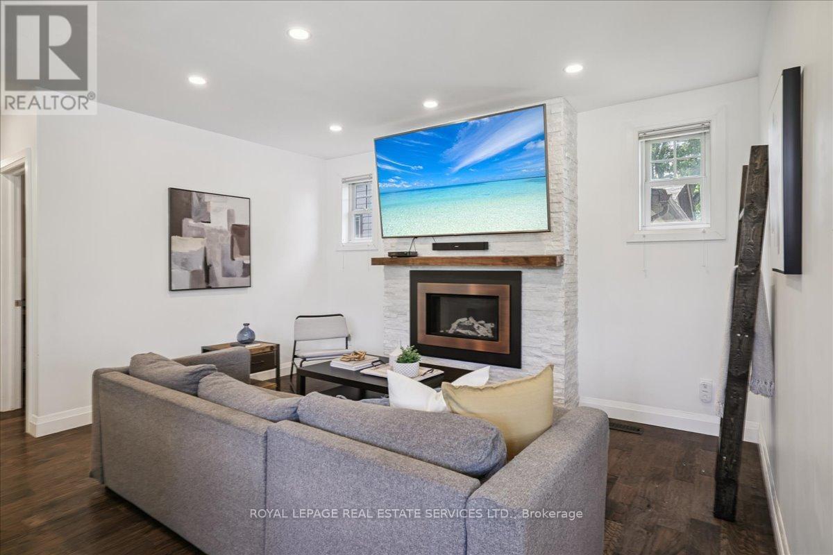 4 Rembe Avenue, Hamilton, ON - Indoor Photo Showing Living Room With Fireplace