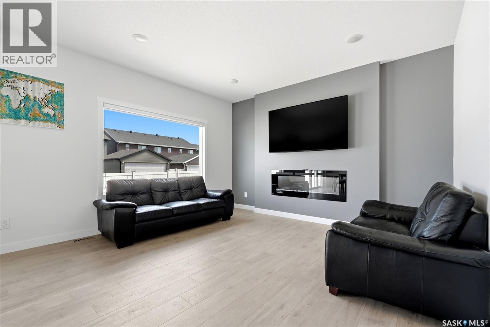 5416 Boyer Bay, Regina, SK - Indoor Photo Showing Living Room With Fireplace