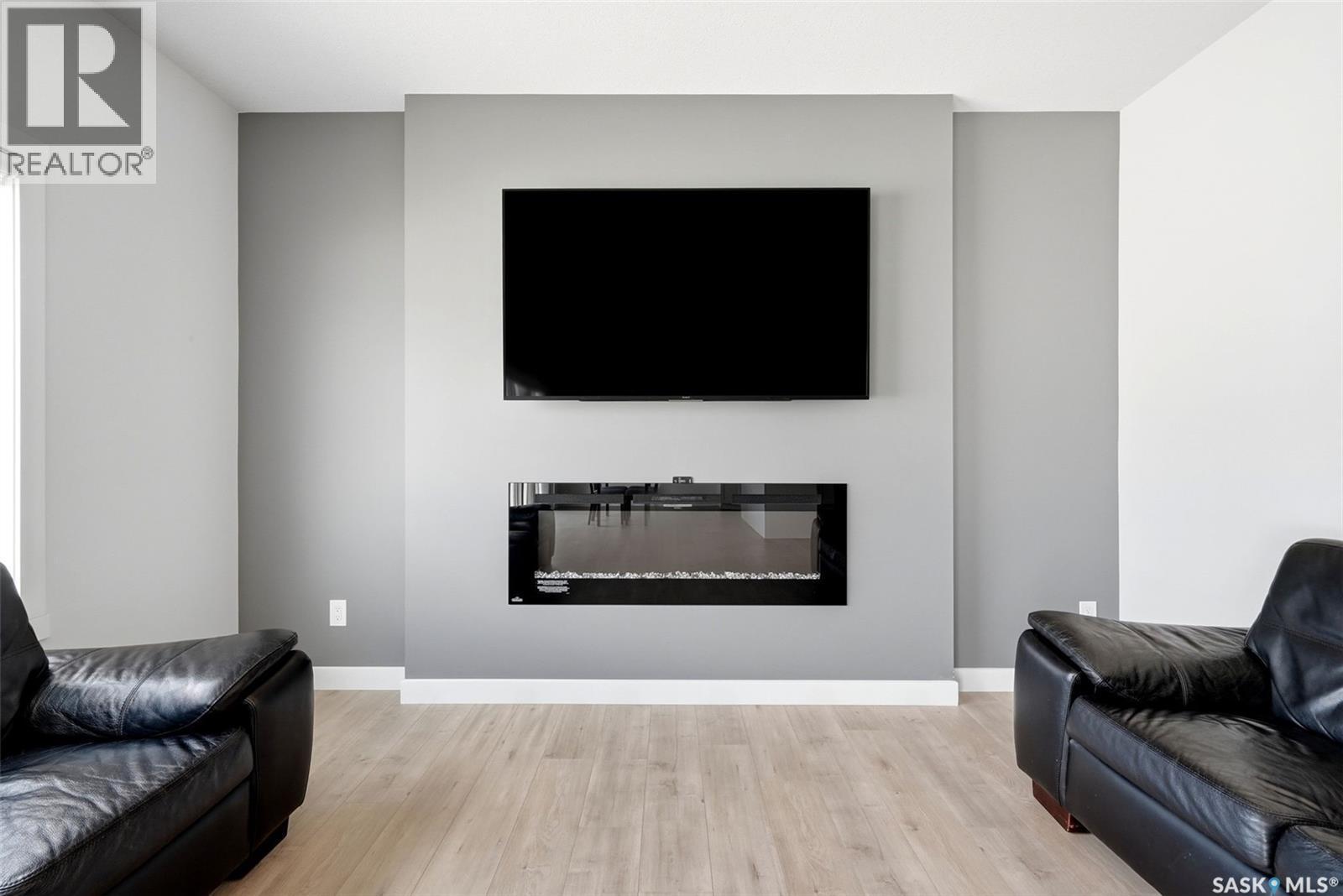 5416 Boyer Bay, Regina, SK - Indoor Photo Showing Living Room With Fireplace