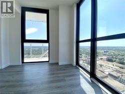 Open concept room with expansive floor-to-ceiling windows featuring black framing -