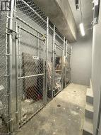 Dedicated storage unit featuring a chain-link fence enclosure and a concrete floor -