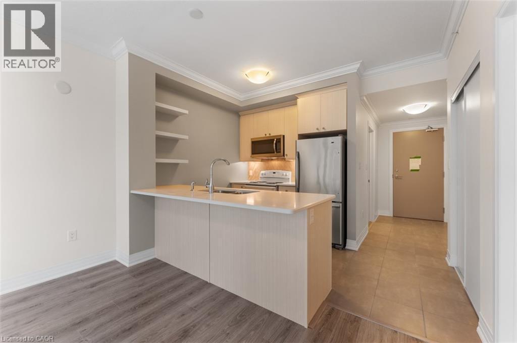 10 Concord Place Unit# 213, Grimsby, ON - Indoor Photo Showing Kitchen With Double Sink
