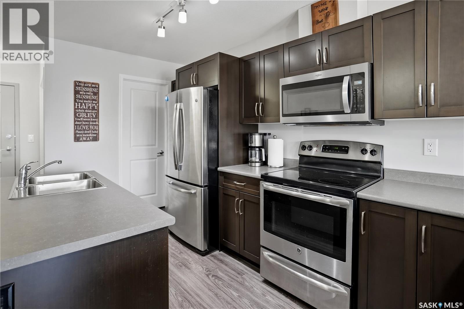 305 2452 Killdeer Drive, North Battleford, SK - Indoor Photo Showing Kitchen With Stainless Steel Kitchen With Double Sink