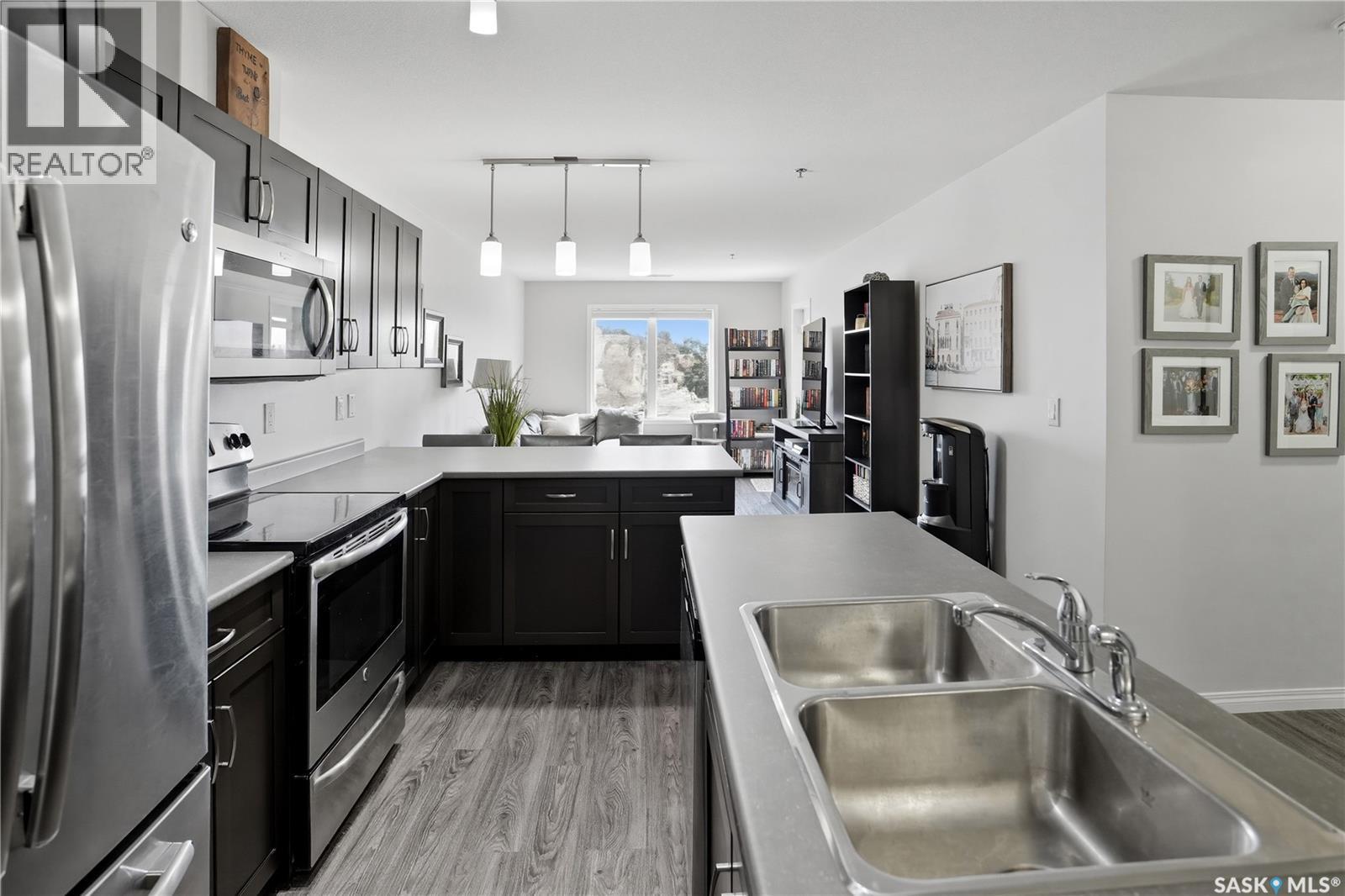 305 2452 Killdeer Drive, North Battleford, SK - Indoor Photo Showing Kitchen With Stainless Steel Kitchen With Double Sink With Upgraded Kitchen