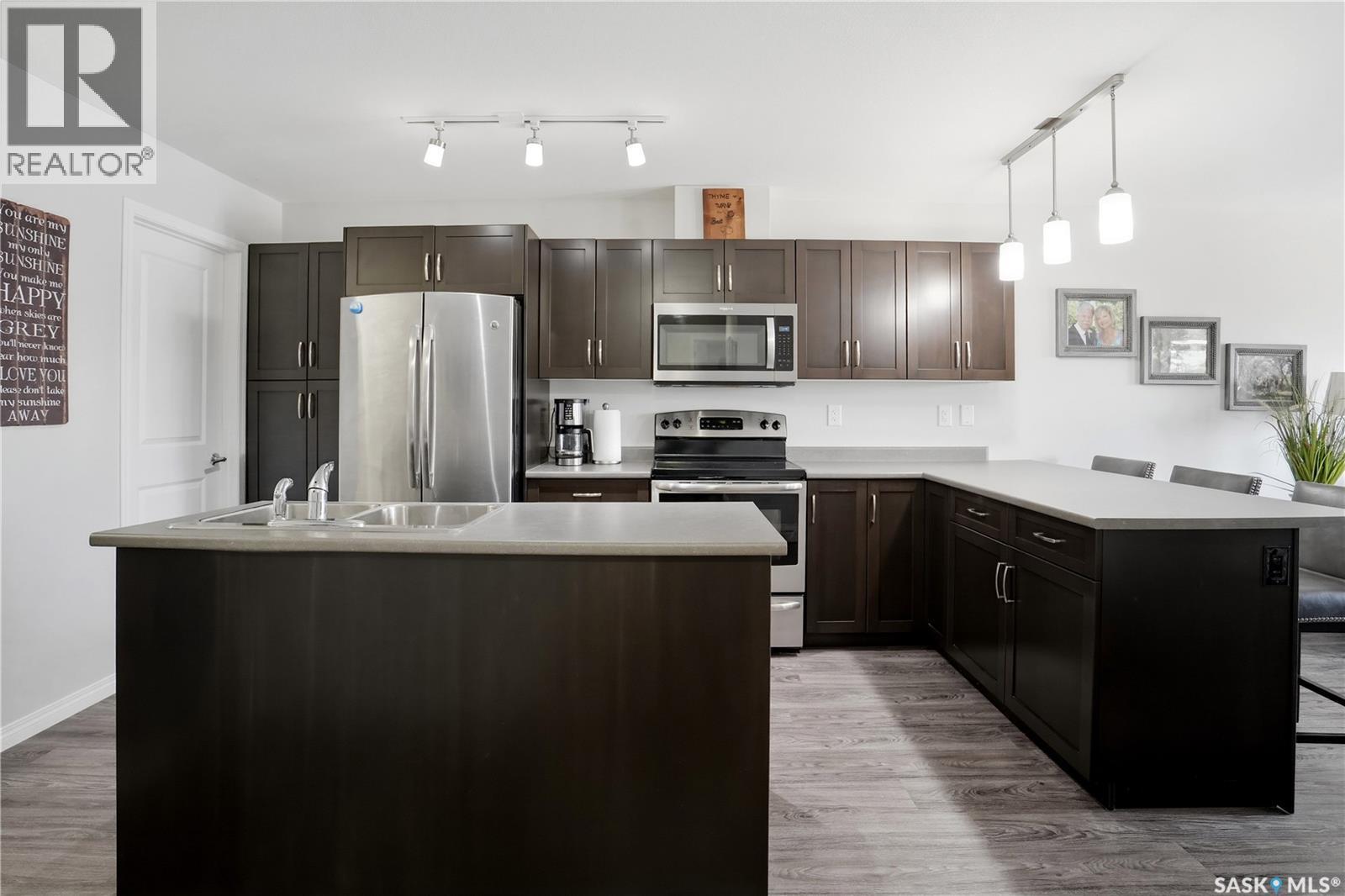 305 2452 Killdeer Drive, North Battleford, SK - Indoor Photo Showing Kitchen With Stainless Steel Kitchen With Double Sink