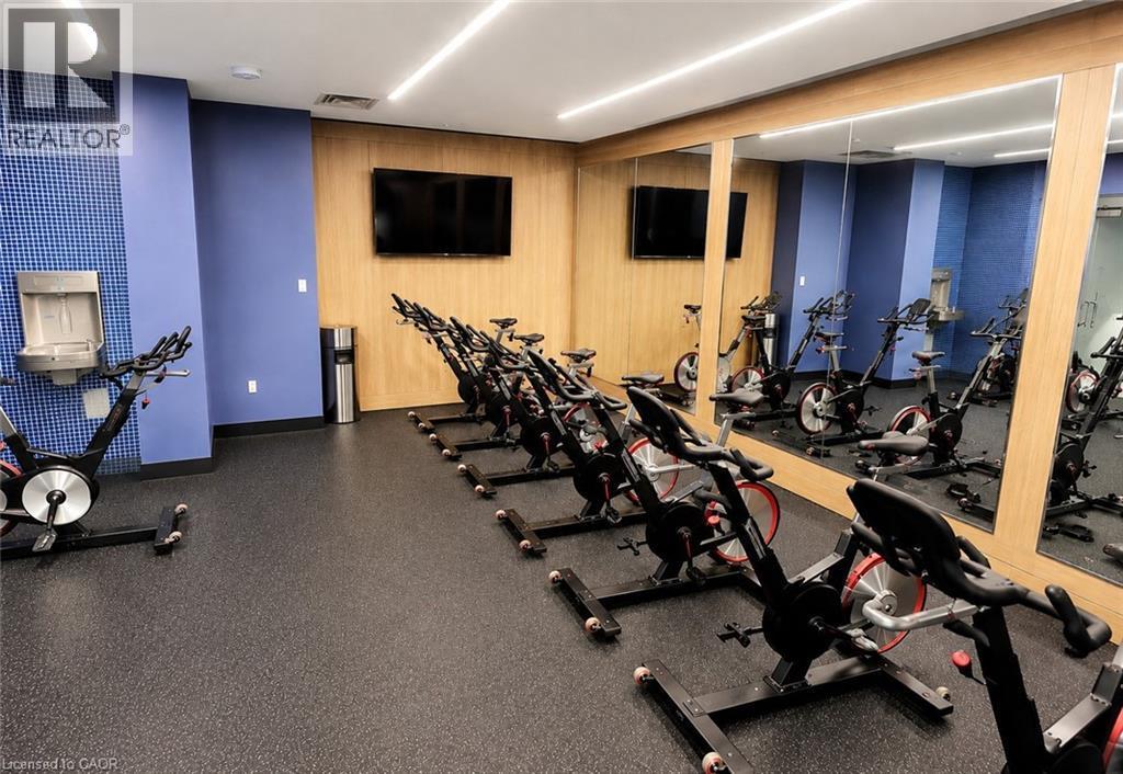 Dedicated spin room featuring multiple exercise bikes - 75 James Street S Unit# 2614, Hamilton, ON - Indoor Photo Showing Gym Room