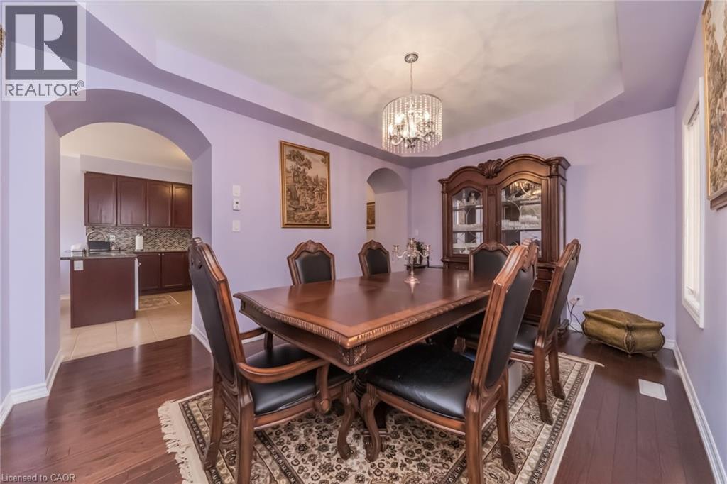 Formal dining area featuring hardwood flooring - 675 Best Road, Milton, ON - Indoor Photo Showing Dining Room