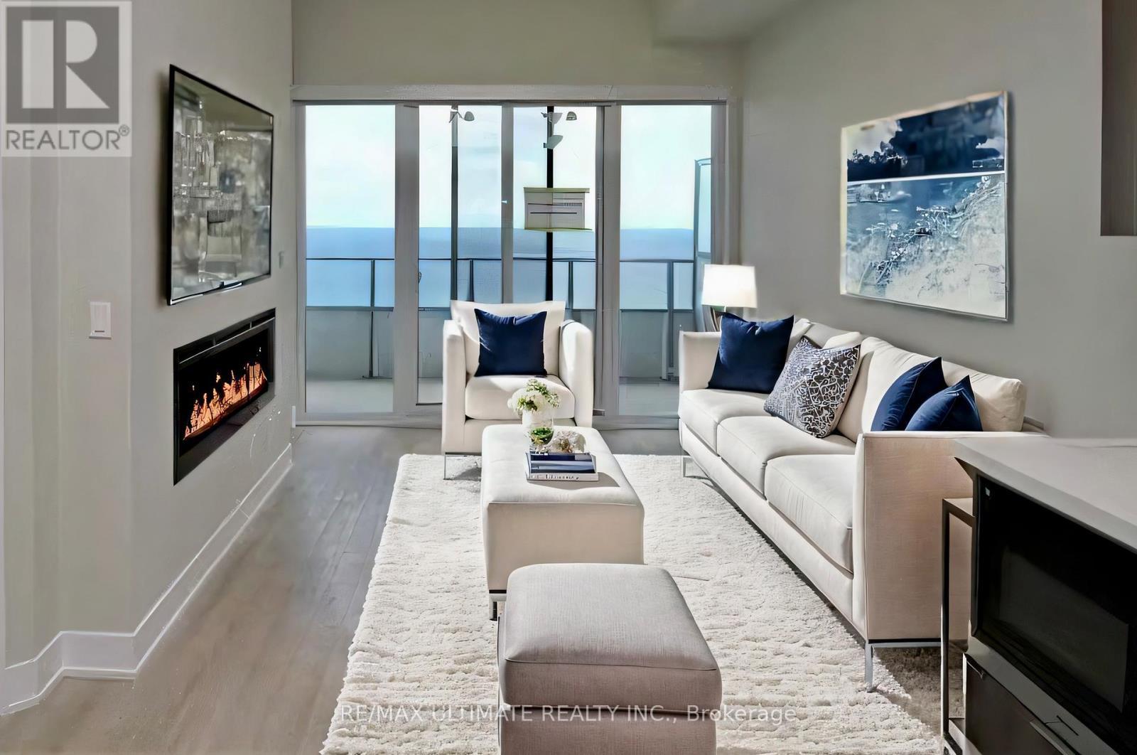 6206 - 30 Shore Breeze Drive, Toronto, ON - Indoor Photo Showing Living Room With Fireplace