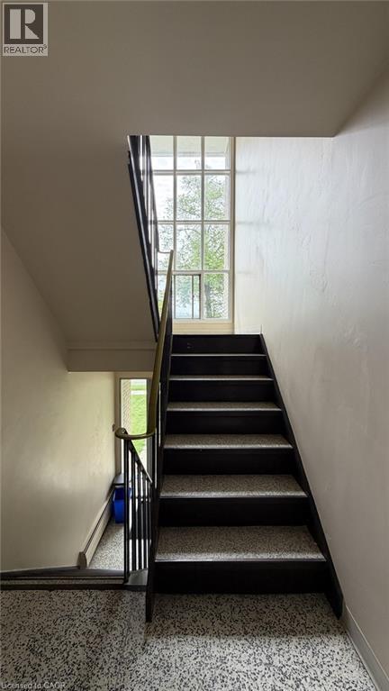 Stairwell featuring a multi-paned window - 206 Indian Road, Kitchener, ON - Indoor Photo Showing Other Room