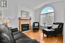 Family room with gas FP and large arched window -