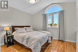 Large secondary bedrm w/ partial cathedral ceiling -