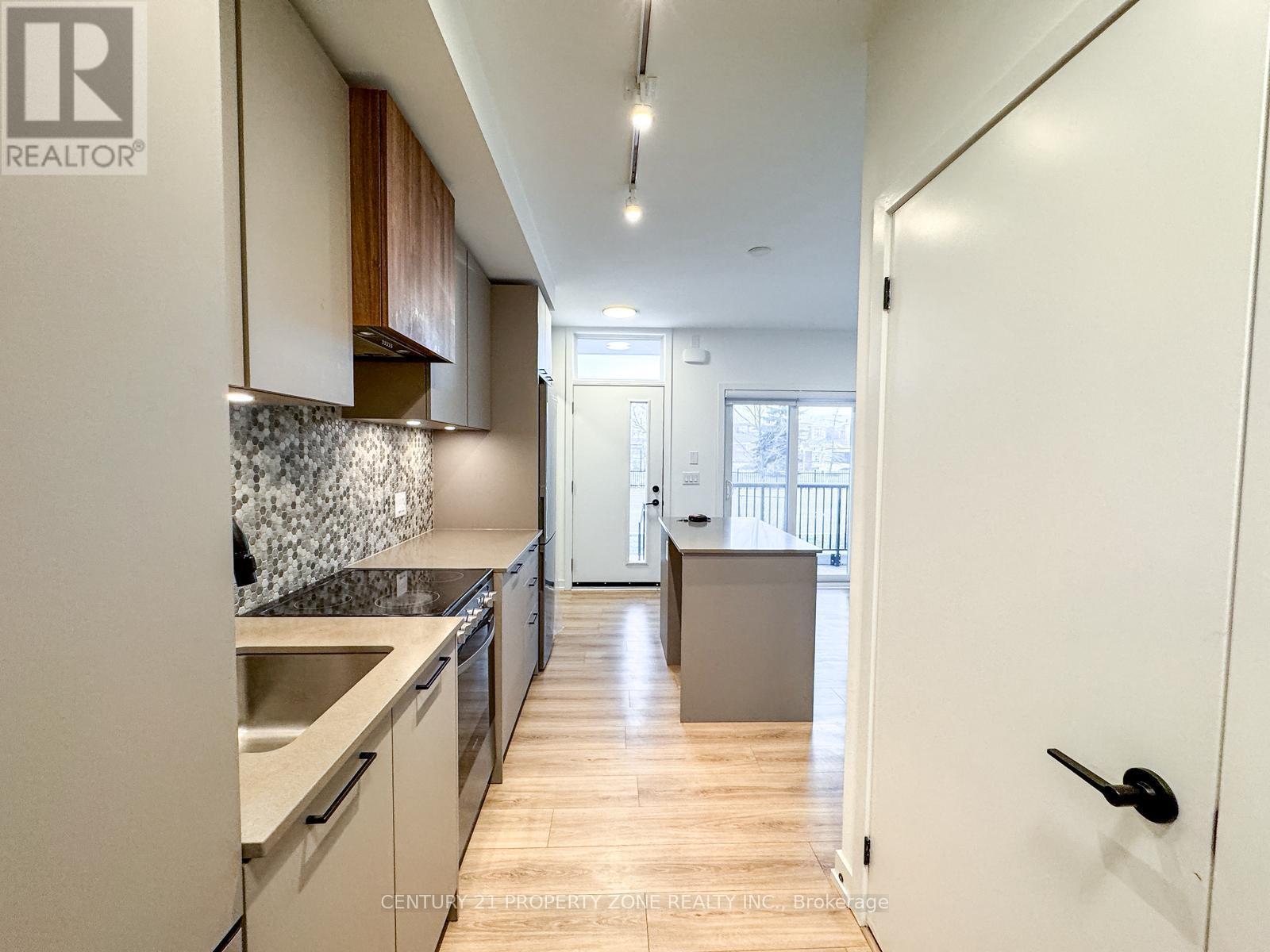 06 - 20 Lagerfeld Drive, Brampton, ON - Indoor Photo Showing Kitchen With Upgraded Kitchen