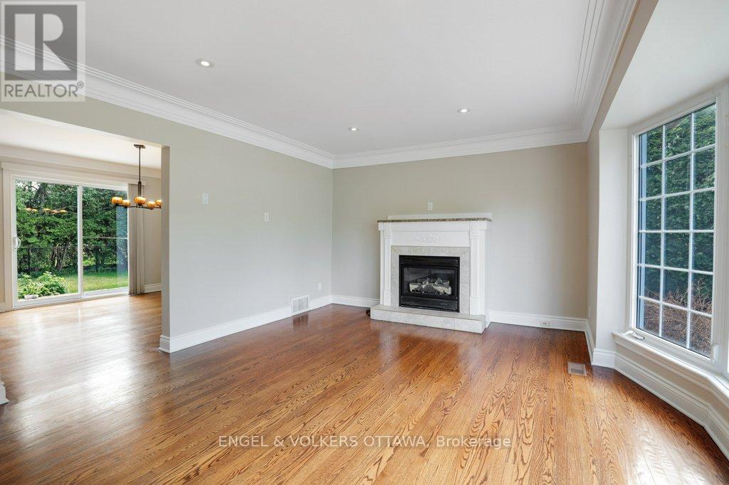 23 Biscayne Crescent, Ottawa, ON - Indoor Photo Showing Living Room With Fireplace