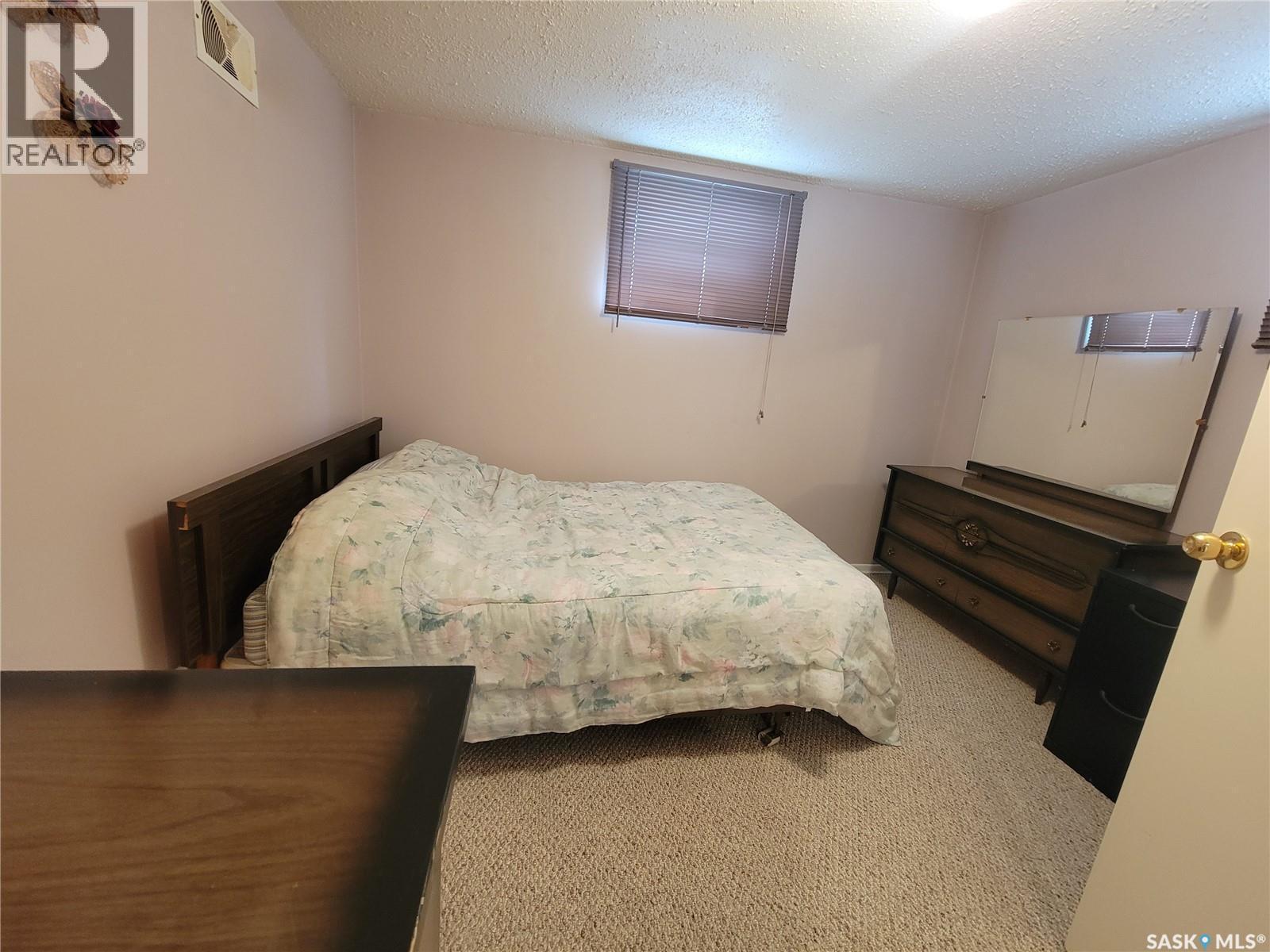 303 3 Street E, Wilkie, SK - Indoor Photo Showing Bedroom