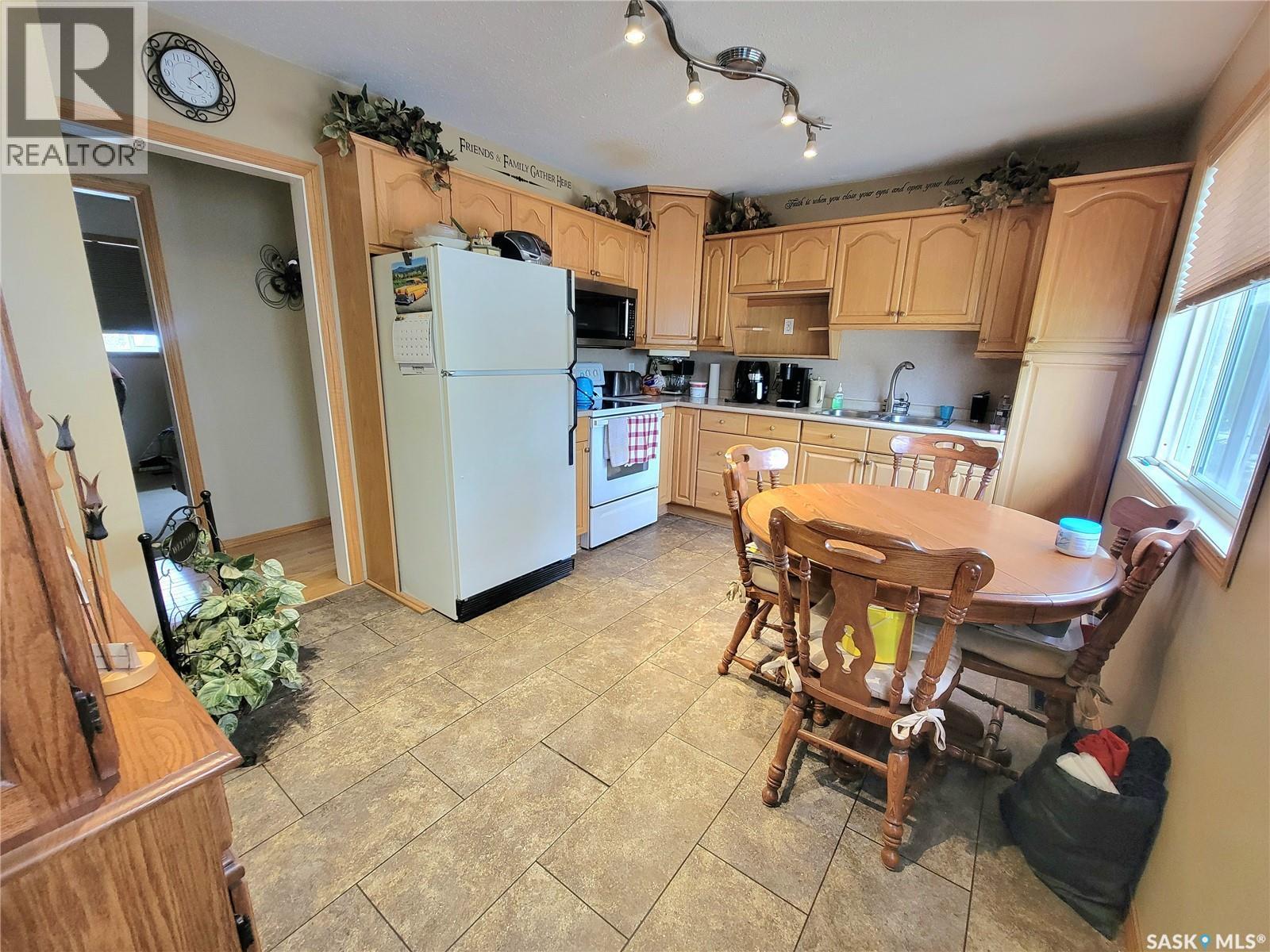 303 3 Street E, Wilkie, SK - Indoor Photo Showing Kitchen With Double Sink